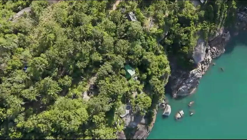 Aerial view of the jungle, rocks and boats on the Why Nam coast