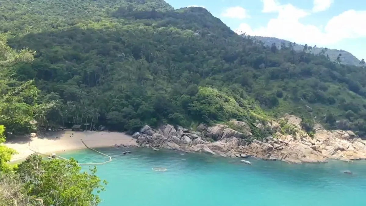 Hidden beach and turquoise bay below the jungle at Why Nam, Koh Phangan