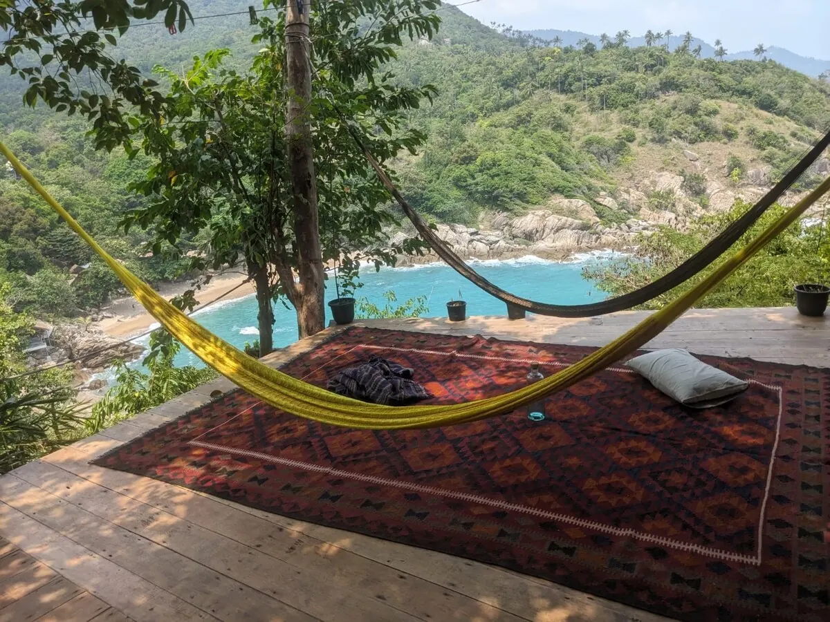 Hammock and Persian rug on the deck above the cove